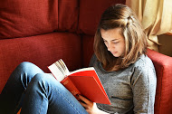 girl reading on the couch